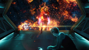 Heroine in fiery cosmic energy facing kneeling man in spaceship. — Captain Marvel Computer Picture