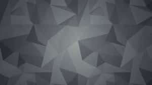 Patrón geométrico abstracto de triángulos grises con degradados suaves y textura moteada. — Imágenes de Destacados Imágenes