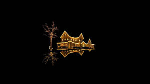 A glowing house with lights and a tree reflected in water at night. — Christmas Mac Picture