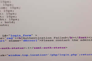 Computer screen showing HTML code with authentication failed error in red. — Code Wallpaper