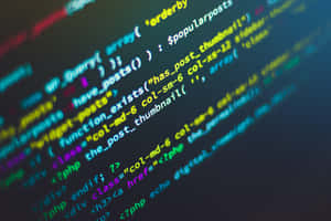 Close-up of glowing colorful code on a dark screen. — Code Wallpaper