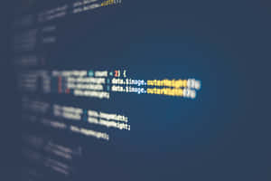 Blurred lines of computer code on a dark blue screen. — Code Wallpaper