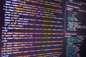 Close-up of colorful computer code on a dark screen. — Code Wallpaper