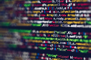 Vibrant blurred lines of programming code on a dark screen. — Coding Picture