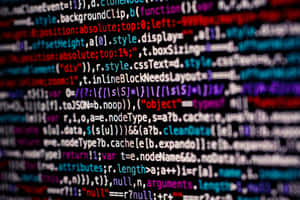 Blurred colorful lines of computer programming code on a digital screen. — Coding Picture