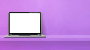 Silver laptop with blank screen on purple shelf against purple wall — Computer Screen Wallpaper