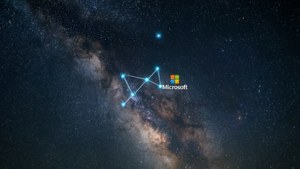 The Microsoft logo formed as a constellation in a starry night sky.