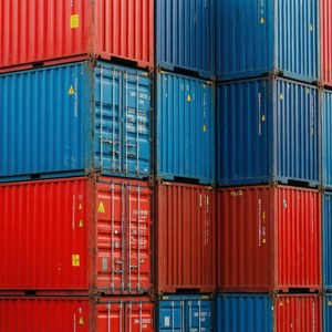 A colorful abstract pattern of stacked shipping containers.