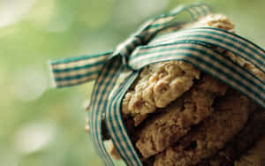 Stack of oatmeal cookies tied with a green and white checkered ribbon.