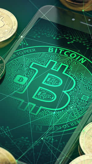 Smartphone showing Bitcoin logo with physical coins nearby.