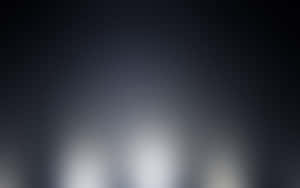 Minimalist abstract gradient from dark gray to bright white with soft blurred glow. — Dark Gradient Picture