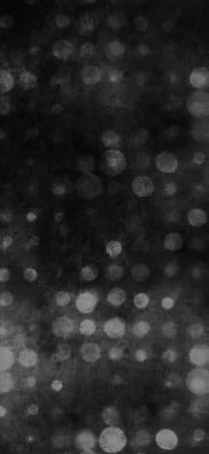 Abstract black and white bokeh pattern with soft glowing circles on textured background — Dark Retro Picture