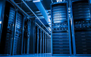 Rows of server racks in a blue-lit data center — Data Wallpaper