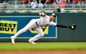 Baseball player diving to catch a ball during a game. — Derek Jeter Picture
