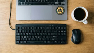 Minimalist desk setup with Node.js sticker