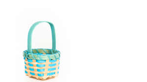 Small woven basket with turquoise and wood tones on white background