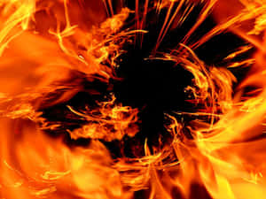 Vibrant orange and yellow flames swirling outward from a dark center. — Firecracker Picture