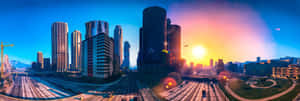 Sunset over a modern city with tall buildings and busy highways.