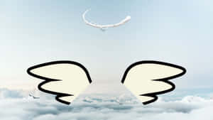 Cartoon wings and moon above snowy mountains and clouds.