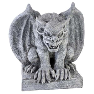 Stone gargoyle statue with wings spread and claws gripping pedestal. — Gavial Background