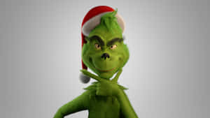 Grinch usando chapéu de Papai Noel sorrindo com o dedo nos lábios. — Imagens de Christmas Grinch Fotos