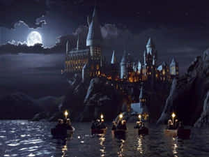 Students in boats with lanterns rowing toward a castle on cliffs under a full moon.