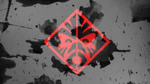 Red geometric face symbol on black and gray splattered background