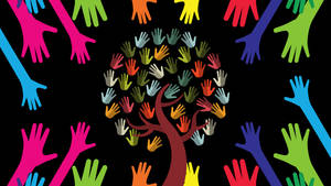 A tree formed from colorful hands surrounded by reaching hands against a black background. — Unity Wallpaper