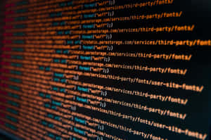 Computer-coderegels die scrollen op een donker scherm met oranje en blauwe accenten.