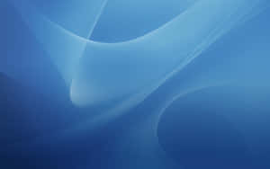 Abstract blue background with flowing wave patterns and soft lighting.