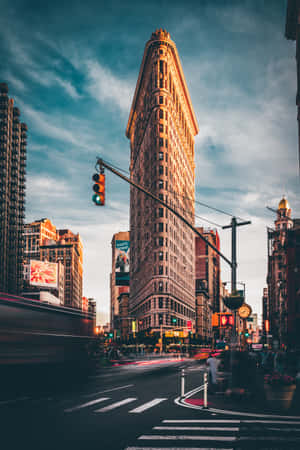 Flatiron Building at dusk with light trails from traffic — New York City Picture
