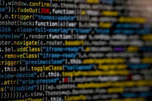 Close-up of blurred programming code on a computer screen. — It Computer Picture