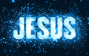 Leuchtend blauer Text JESUS umgeben von funkelnden Partikeln auf dunklem Hintergrund.