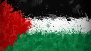 Abstract artistic rendition of the Palestinian flag with splattered paint textures.