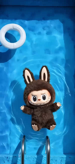 A brown bunny plush toy floating in a blue swimming pool with a white ring and ladder.