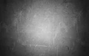 Pared texturizada gris oscuro con rayones y resplandor de luz central. — Alta calidad negra Fondos de pantalla