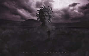 A small figure faces a giant Medusa head statue in a stormy, purple-hued wasteland.