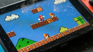 Macro photography wallpaper of Nintendo Switch screen with Mario