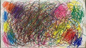 Garabato colorido y desordenado de marcador sobre papel, expresivo y caótico.