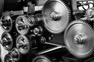 Detailed view of interconnected metal gears in industrial machinery.