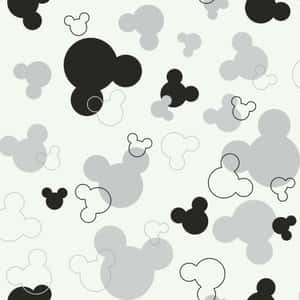 Wallpaper with repeating Mickey Mouse head shapes in black gray and white. — Mickey Picture