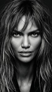 Black and white close-up of Candice Swanepoel with disheveled hair