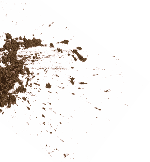 Braune Pulverspritzer auf einer weißen, gegen schwarzen Hintergrund geneigten Fläche. — Mudskipper Wallpaper