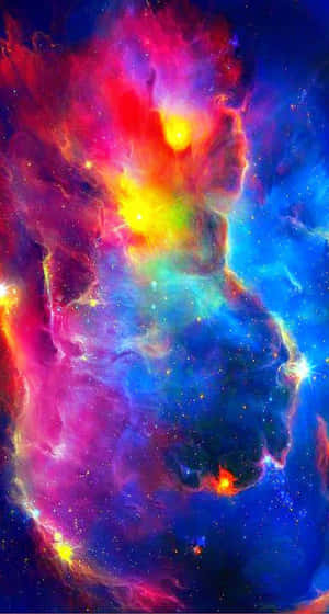 Vibrant cosmic nebula with swirling pink blue and yellow gases and glowing stars. — Multicolor Wallpaper