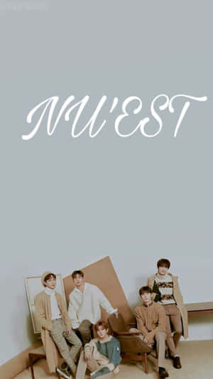 Five K-pop idols in beige and white outfits posing in a minimalist studio with 'NU'EST' text. — Nuest Picture