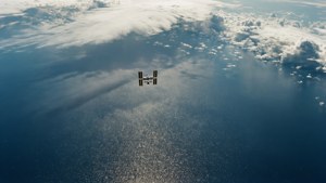 Minimalistic top-down view of ISS above sparkling ocean