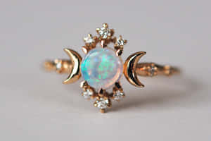 Gold ring with opal and diamond crescent moons