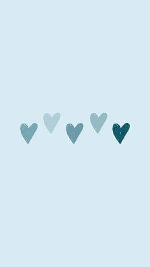 Five blue hearts in a row on a light blue background. — Pastel Blue Solid Picture