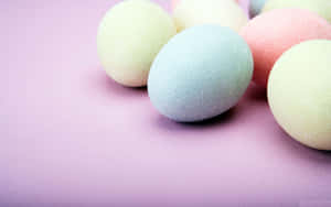 Pastel sugared eggs on a lavender textured surface. — Cute Easter Background
