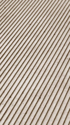 Diagonal ridged texture on beige surface with subtle imperfections. — Diagonal Lines Picture